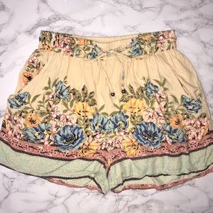 Francesca’s Blue Rain Hawkins Border Floral Shorts